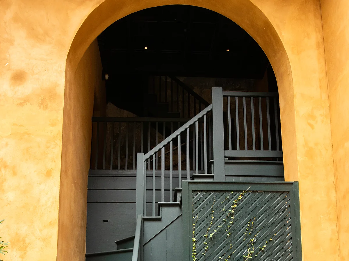 Spanish Colonial courtyard archway with stucco walls in the French Quarter