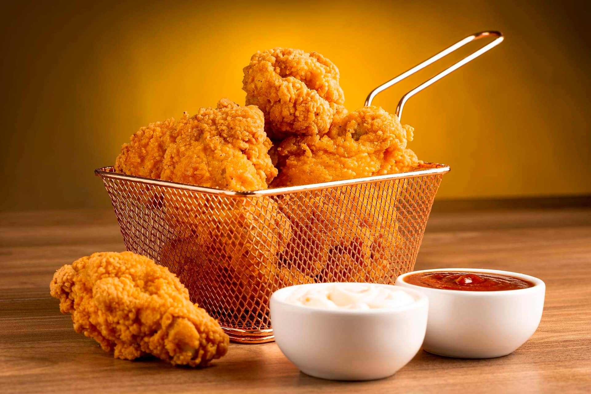 New Orleans Attractions crispy fried chicken served with dipping sauce