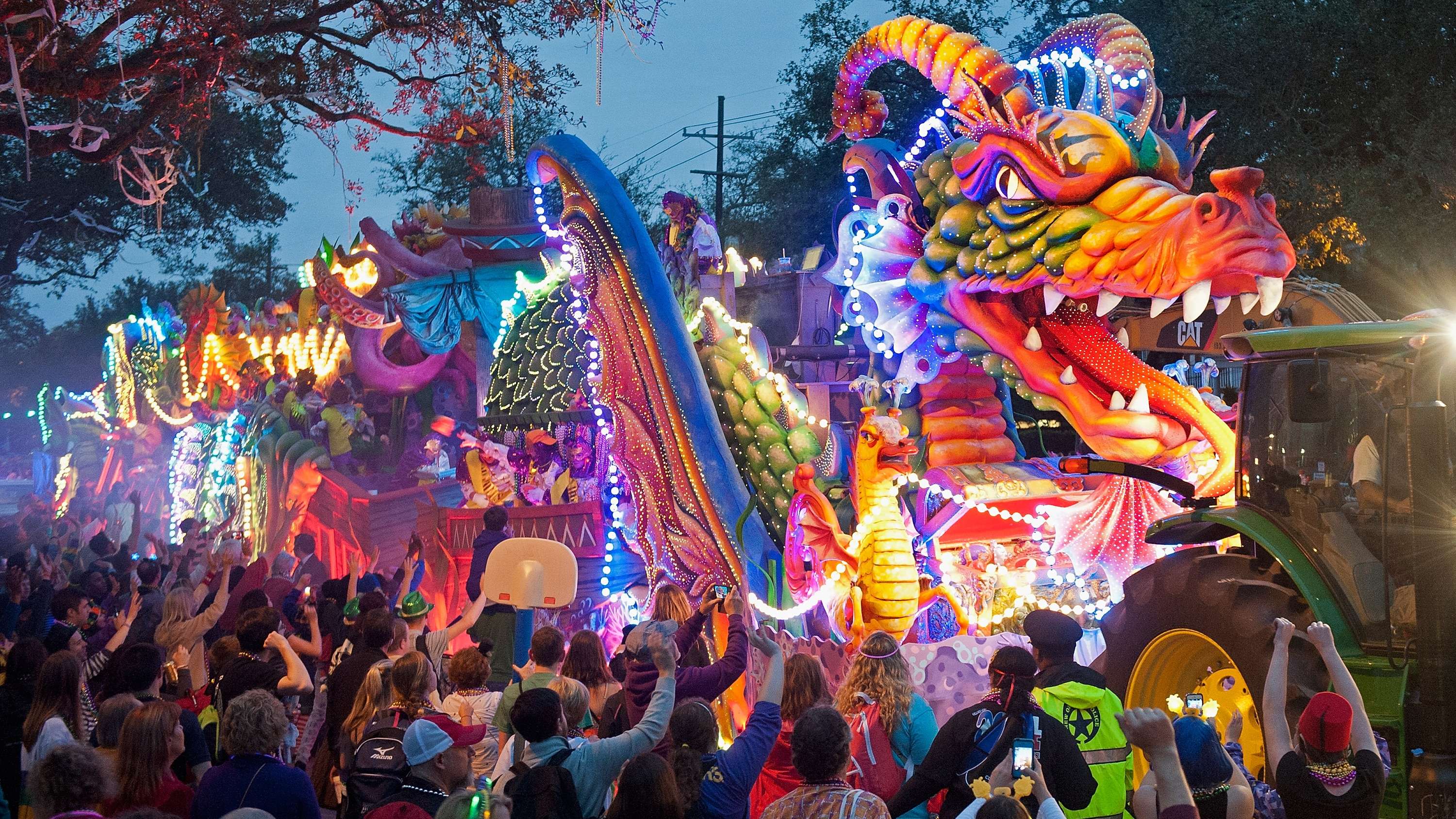 A dragon float passes spectators of a parade during Mardi Gras in New Orleans